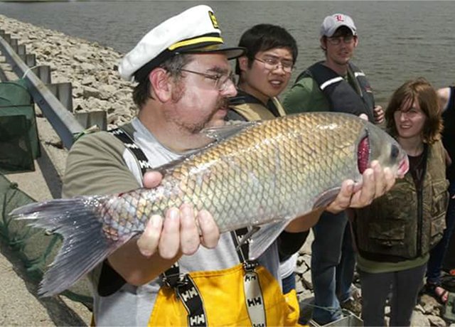 researcher holding fish
